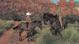 Bob Bradshaw and son John Bradshaw on horseback